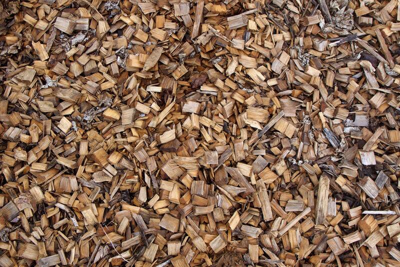 Pile of fresh garden mulch recycled from removed trees
