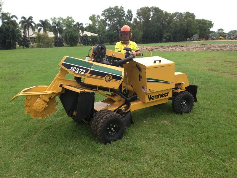 Operator using a Vermeer stump grinder on a Darwin lawn